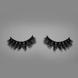 A pair of fake eyelashes is shown on the grey background.