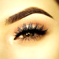 A close up of the eye with long eyelashes