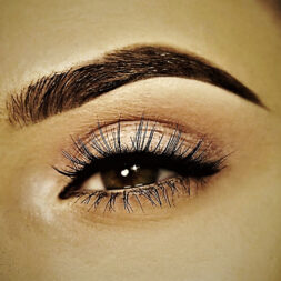 A close up of the eye with long eyelashes