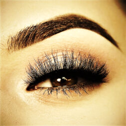 A close up of the eye with long eyelashes