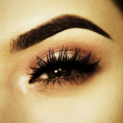 A close up of the eye with long eyelashes