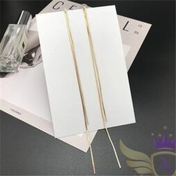 Sleek gold cascade earrings on white display card