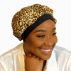 Satin leopard print bonnet with black band for protective styling.