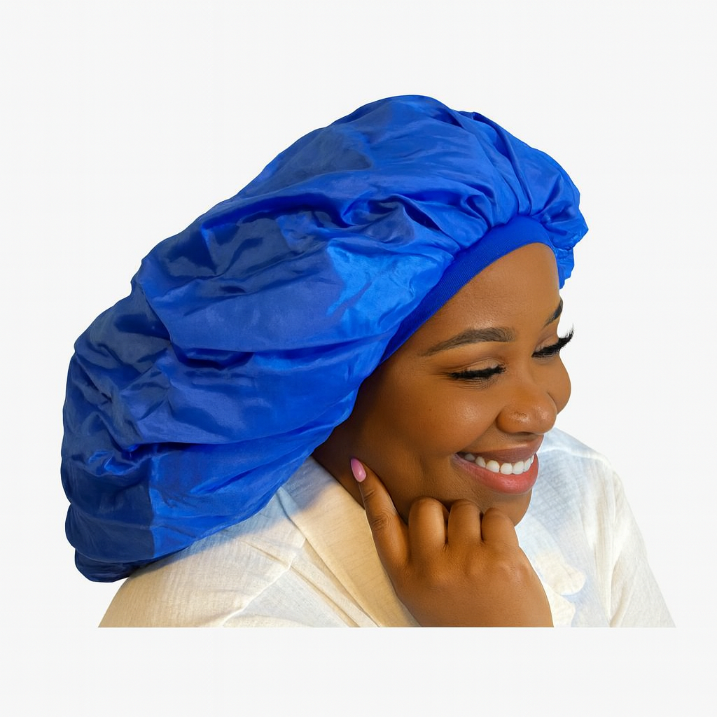 Woman wearing a navy blue bonnet with gold earrings