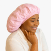 Woman wearing a light pink bonnet while smiling