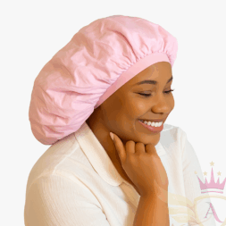 Woman wearing a light pink bonnet while smiling