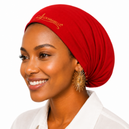 Model wearing red turban-style satin bonnet with protective watermark logo