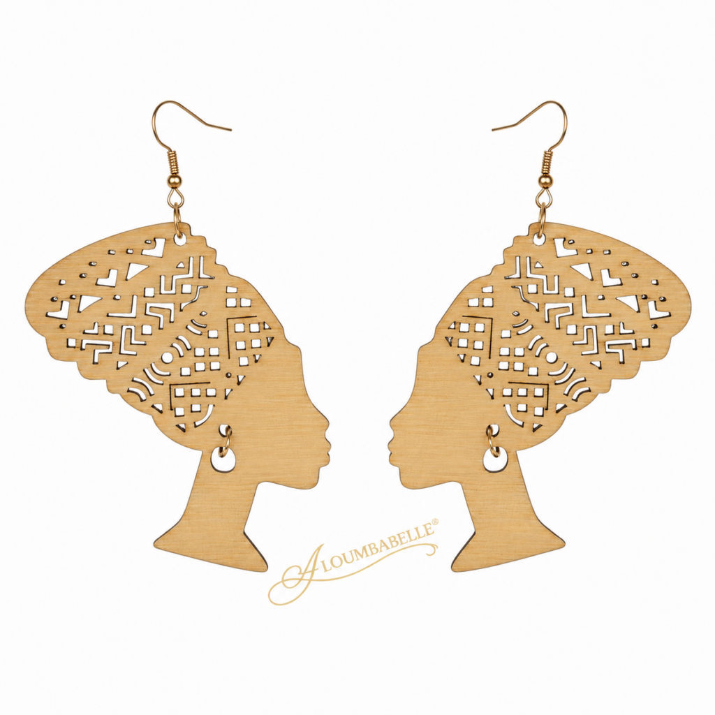 Gold tone wooden African queen silhouette earrings with intricate headwrap cutout design on white background