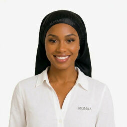 Model wearing an elegant satin sleep bonnet in a black satin finish; ALOUMBABELLE visible as protective image branding and MGMAA visible as a protective watermark, not product features