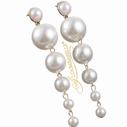 Long cascade pearl drop earrings on black background