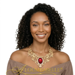African American woman wearing a luxury gold filigree necklace with a ruby red gemstone pendant